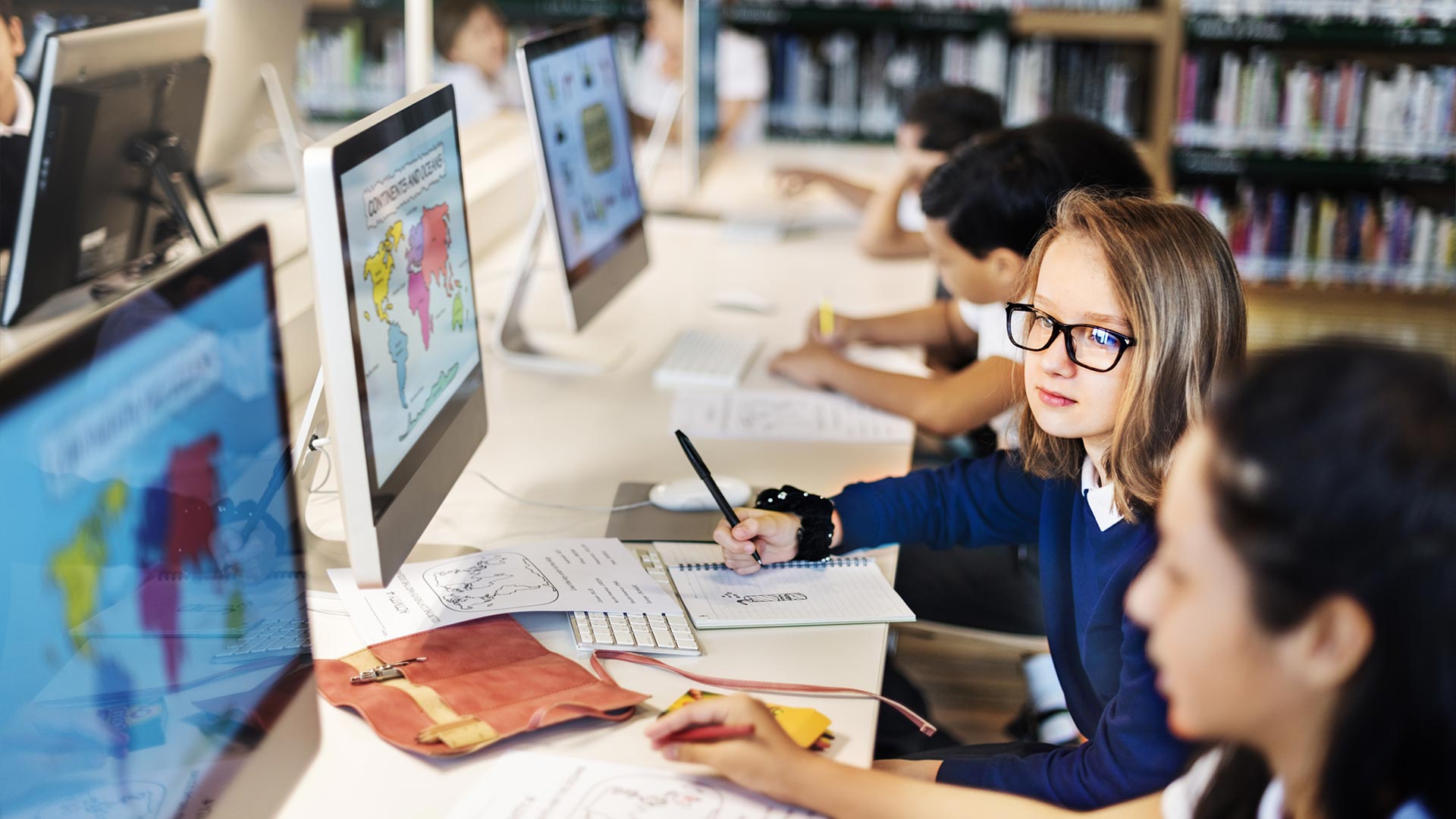 kids looking at computers