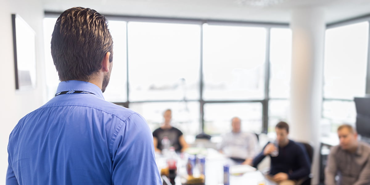 Man giving presentation in business boardroom meeting