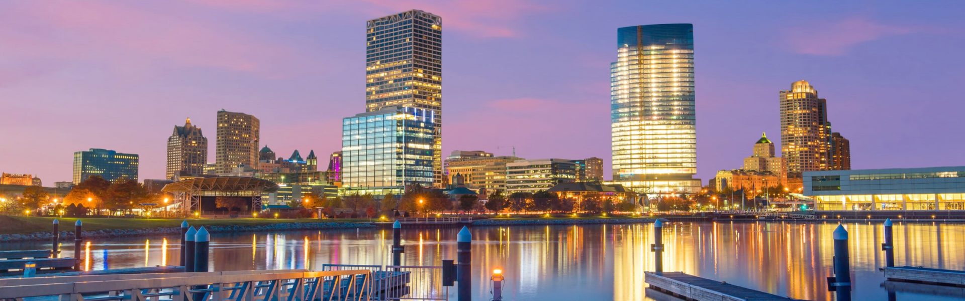 Milwaukee, Wisconsin skyline at sunset with a full moon