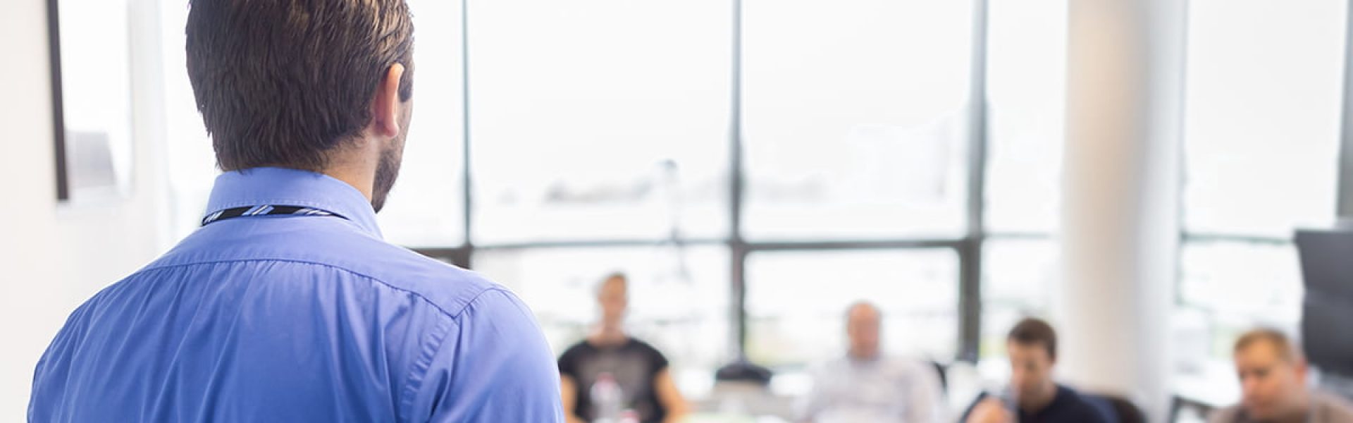 Man giving presentation in business boardroom meeting